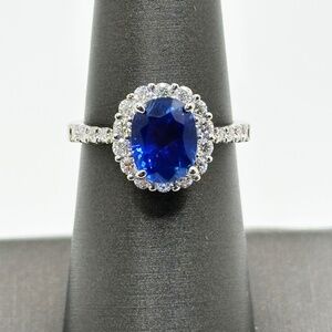 Oval Blue Sapphire and Natural Diamond Halo Ring Set in 18K White Gold